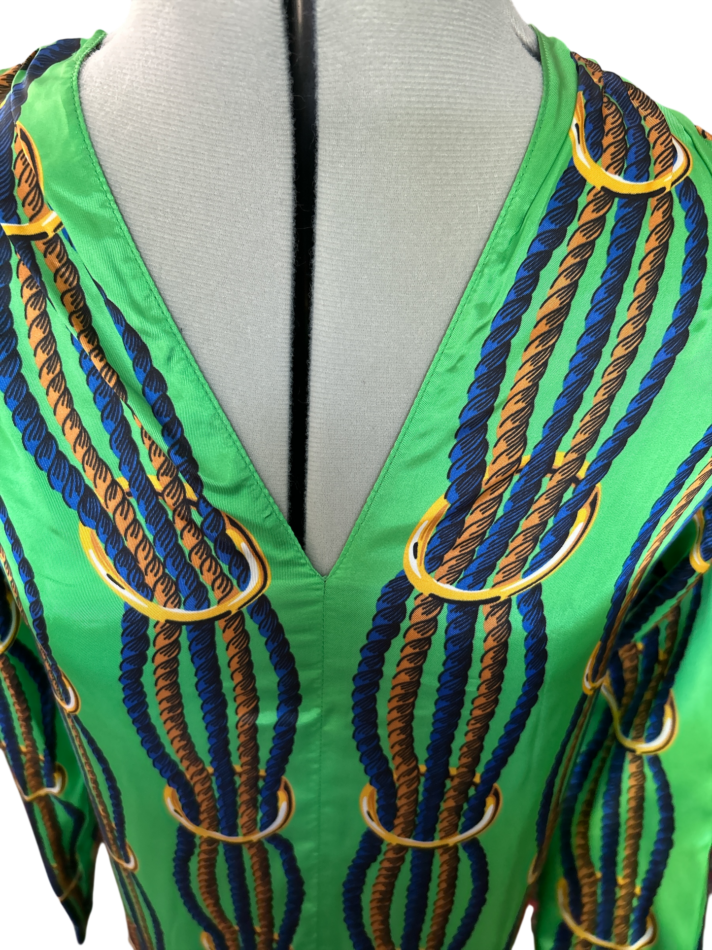 NEW WITH TAGS. JUCCA-MELINDA HAND MADE IN ITALY DRESS/SMOCK UK SIZE. SMALL, 6-8. EU34. V.NECK TWISTED NAVY & GOLD ROPE DESIGN ON LEAF GREEN SATIN MATERIAL.