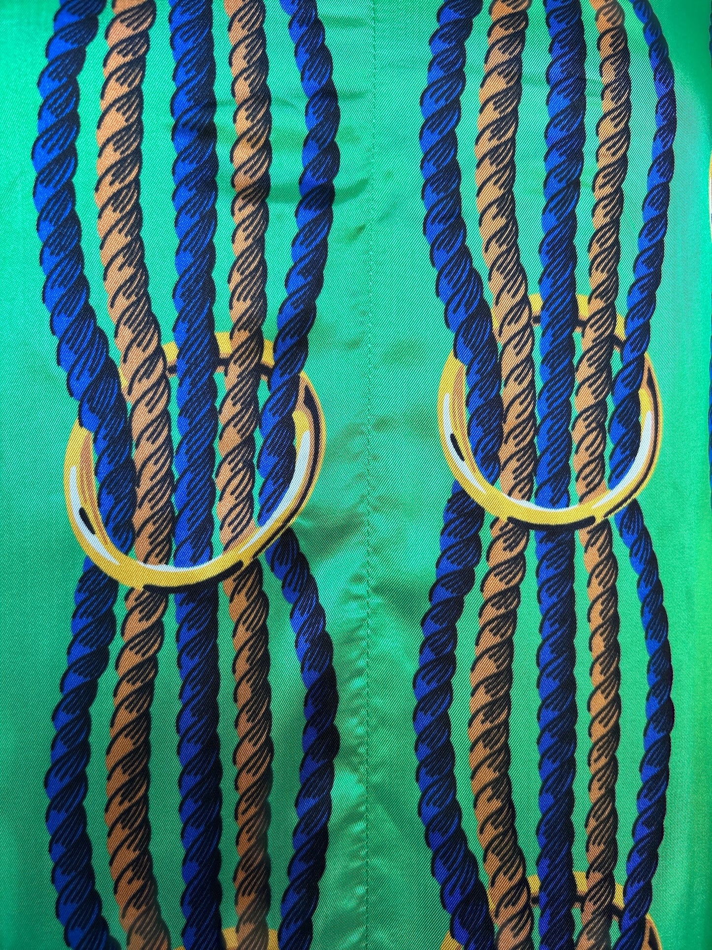 NEW WITH TAGS. JUCCA-MELINDA HAND MADE IN ITALY DRESS/SMOCK UK SIZE. SMALL, 6-8. EU34. V.NECK TWISTED NAVY & GOLD ROPE DESIGN ON LEAF GREEN SATIN MATERIAL.