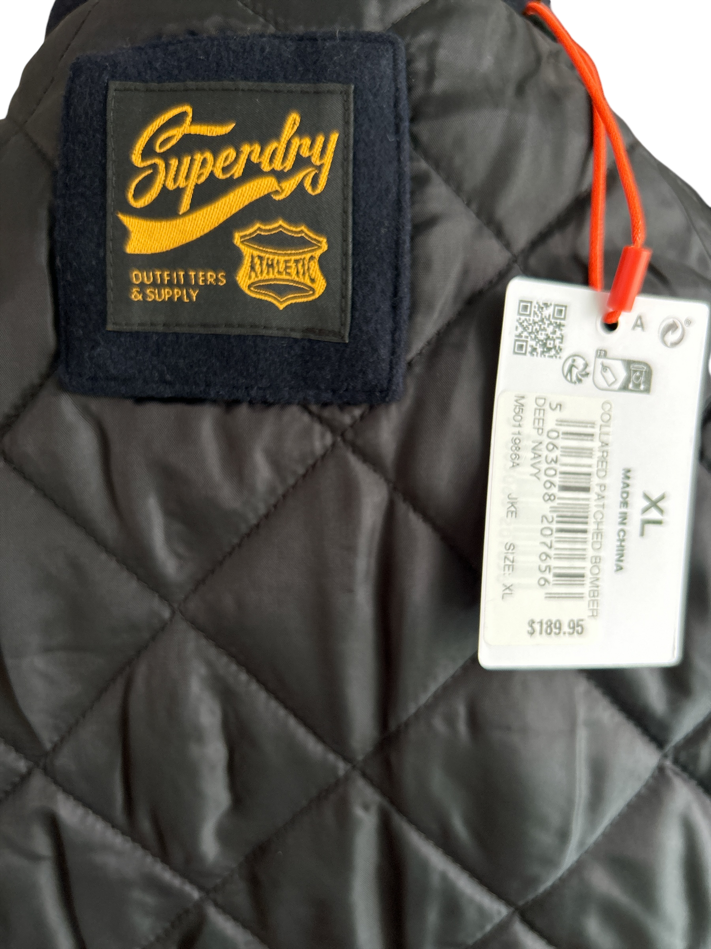 SUPERDRY WILD CATS NAVY COLLARED PATCHED BOMBER IN NAVY UK SIZE EXTRA LARGE.