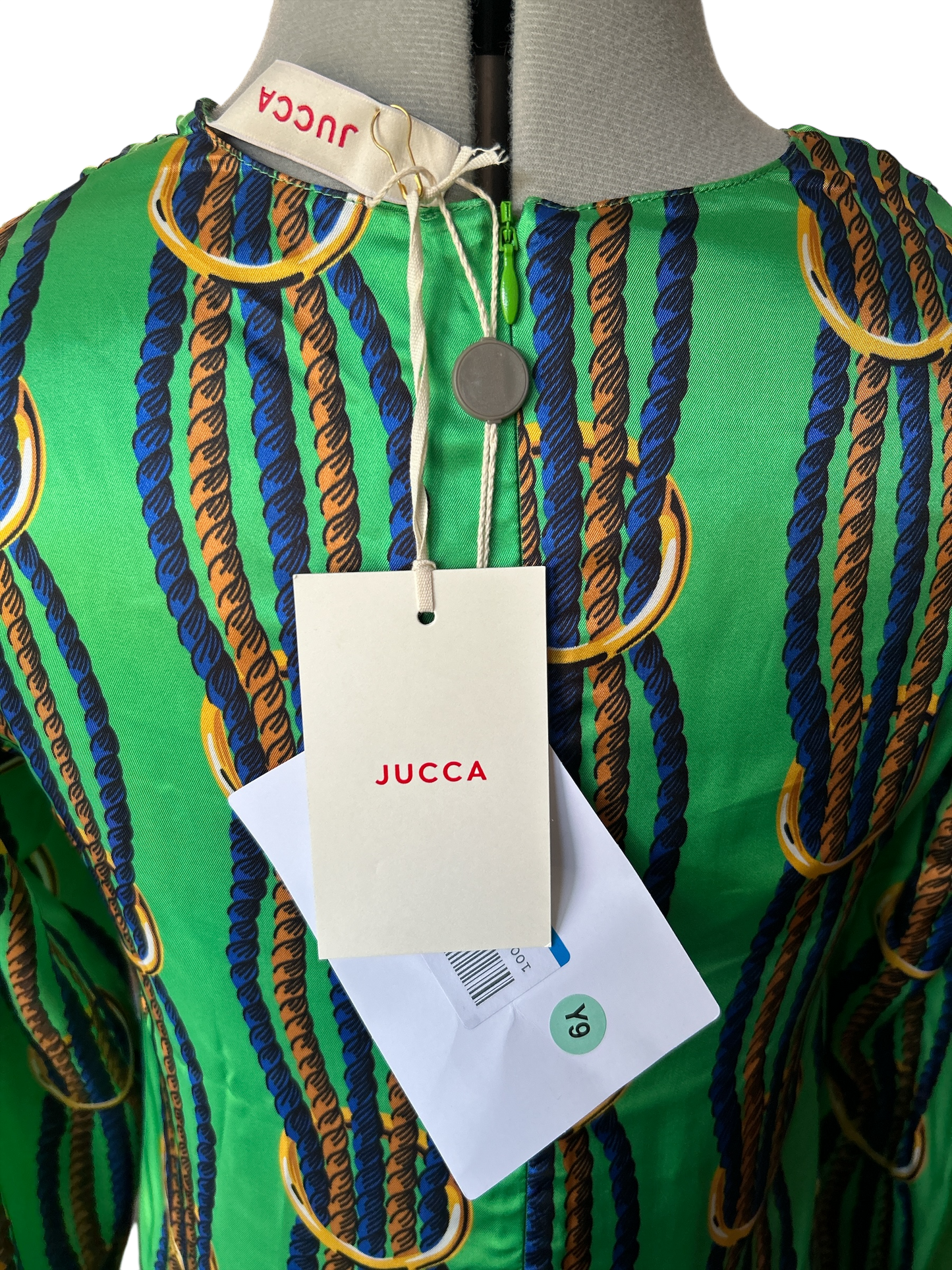 NEW WITH TAGS. JUCCA-MELINDA HAND MADE IN ITALY DRESS/SMOCK UK SIZE. SMALL, 6-8. EU34. V.NECK TWISTED NAVY & GOLD ROPE DESIGN ON LEAF GREEN SATIN MATERIAL.