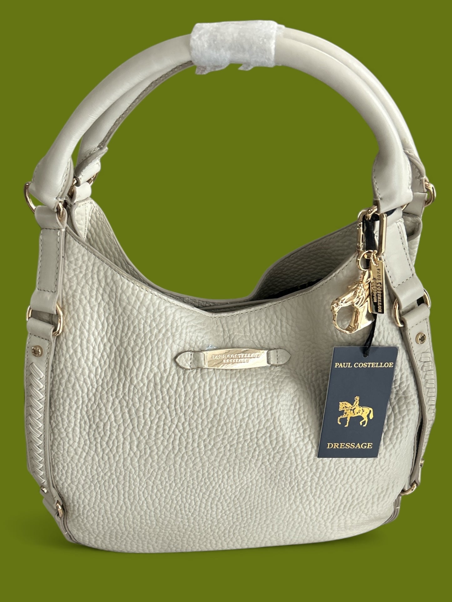 PAUL COSTELLO DRESSAGE, WAVE DETAIL, LARGE SLOUCHY HAND OR SHOULDER, CREAM LEATHER BAG WITH DETACHABLE CHARM. STUNNING LINING.