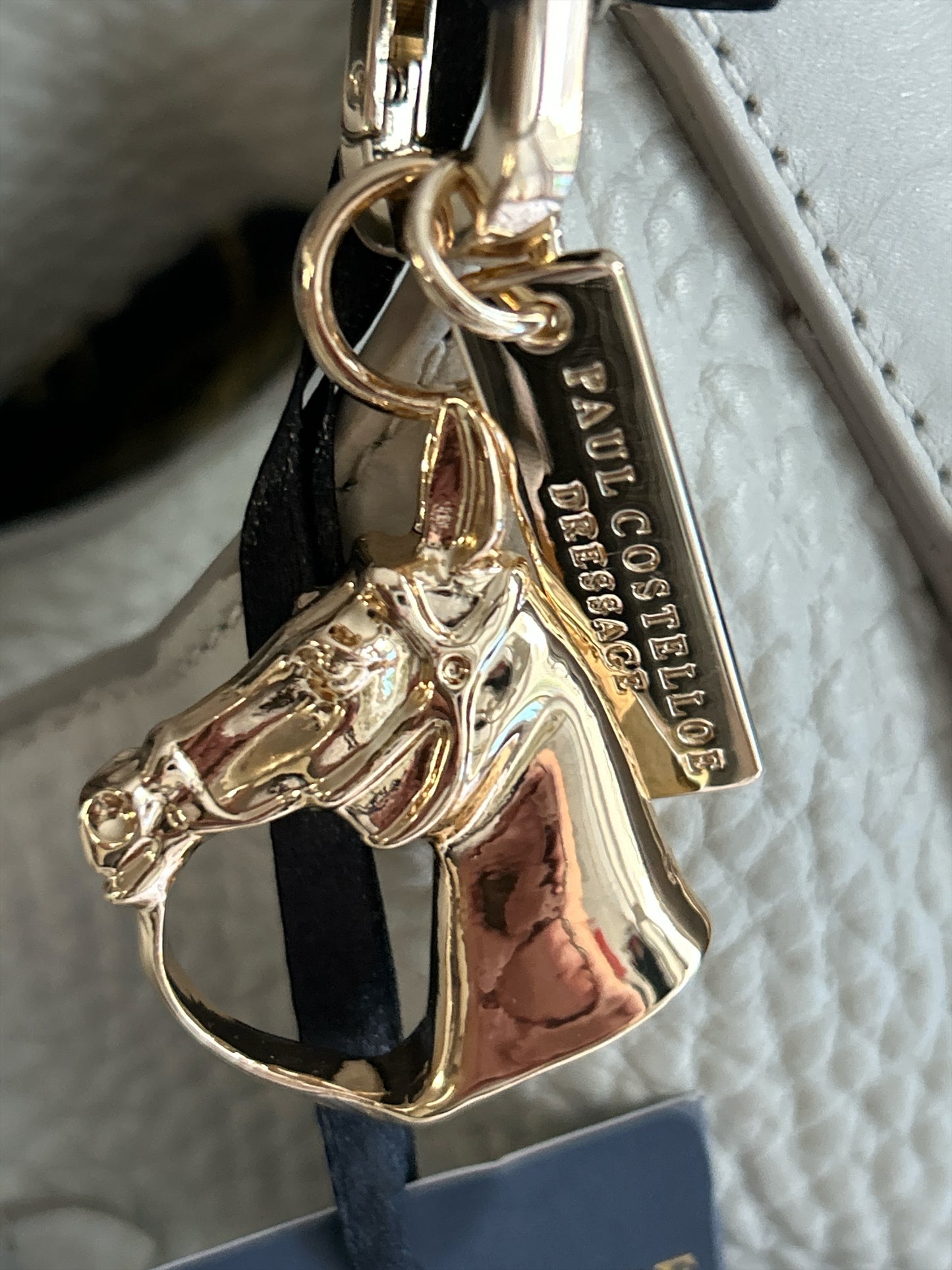 PAUL COSTELLO DRESSAGE, WAVE DETAIL, LARGE SLOUCHY HAND OR SHOULDER, CREAM LEATHER BAG WITH DETACHABLE CHARM. STUNNING LINING.